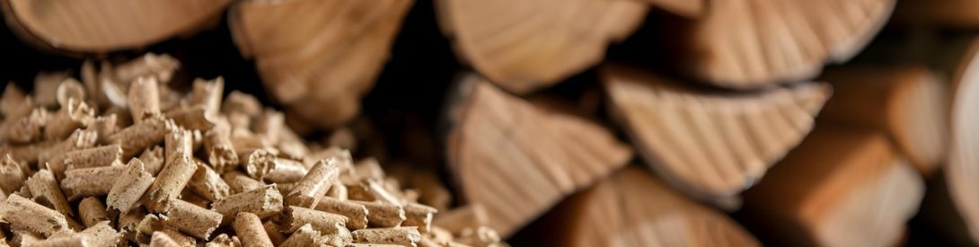 Stacked wood pellets and chopped firewood for fueling a fire. Concept Firewood Storage, Heating Fuel, Renewable Energy, Eco-Friendly Heating Solutions